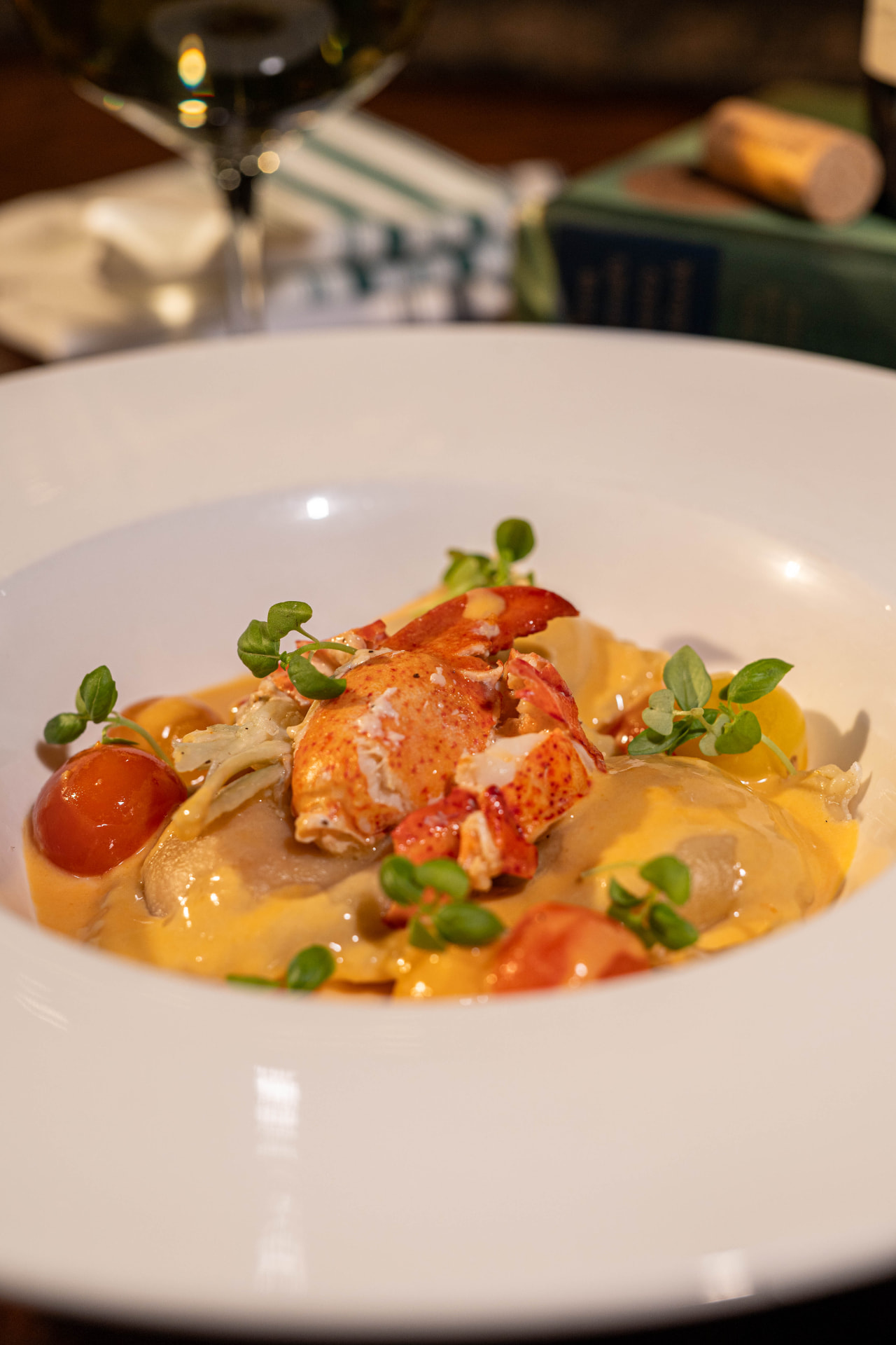 Lobster ravioli with cherry tomatoes and microgreens